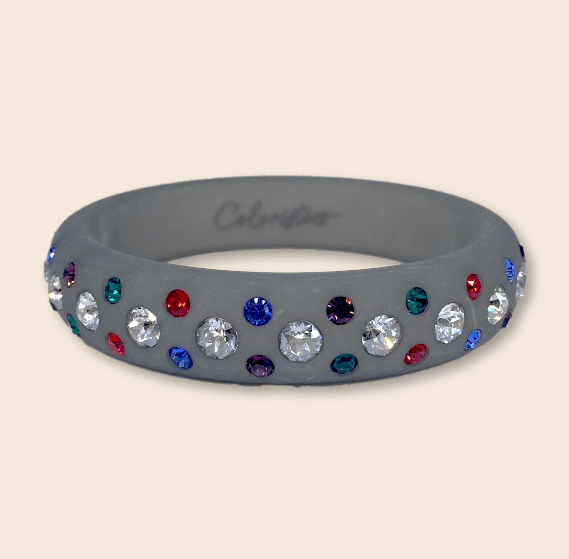 Grauer Coloristers Armreifen mit bunten Kristallen. Grey Coloristers Bangle with colorful crystals.